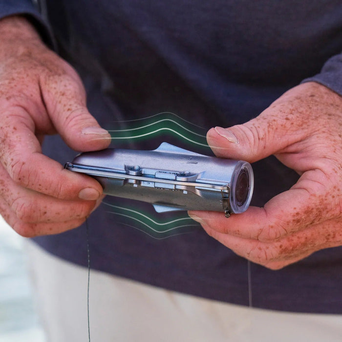 Angler holding CanFish CamX before deployment
