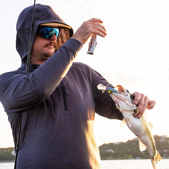 Angler using CanFish Fishing CamX by the water