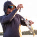 Angler using CanFish Fishing CamX by the water
